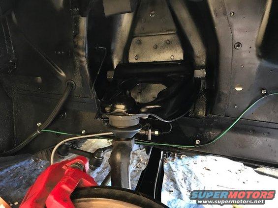 Front suspension assembly with red brake caliper