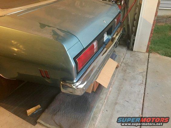 Rear view of a 1975 Chevrolet Chevelle with chrome bumper and rectangular taillights