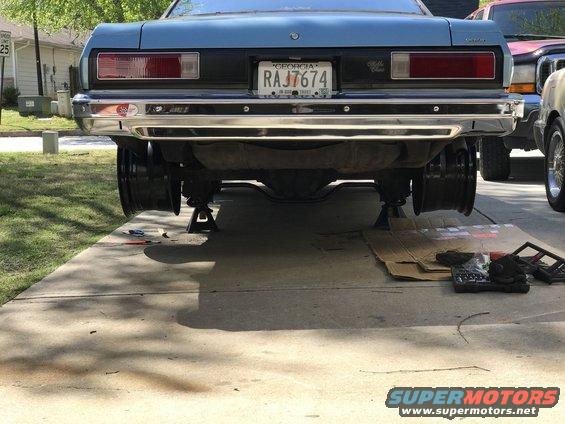 Blue 1975 Chevrolet Chevelle rear end on jack stands, Georgia license plate RAJ7674 visible