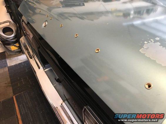 1975 Chevrolet Chevelle hood with several holes drilled in it