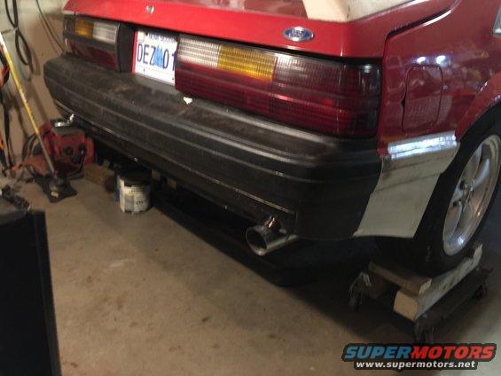 1983 Ford Mustang rear bumper with dual exhaust pipe and license plate DEZ 01