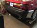 1983 Ford Mustang - Rear view of a red 1983 Ford Mustang showing the bumper, taillights, and exhaust pipe.