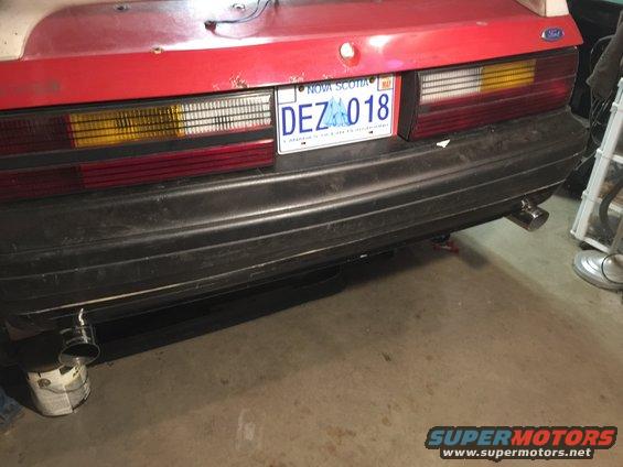 Rear bumper and taillights of a car, with a Nova Scotia license plate reading DEZ 018