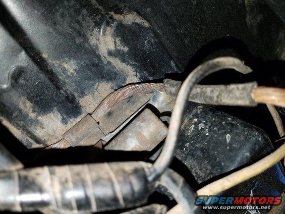 1971 Ford Mustang wiring harness with frayed copper wires and black tape