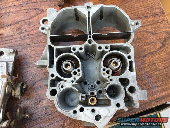 Carburetor part on wooden surface