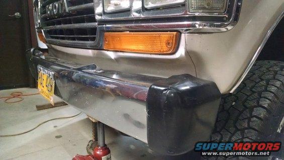 The front bumper is bent, and all 4 end caps are damaged.