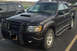 2005 Ford Sport Trac - Front 3/4 view of a 2005 Ford Sport Trac pickup truck with aftermarket accessories.