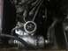 1983 Volkswagen Rabbit - A close-up view of a fuel pressure gauge connected to engine plumbing.