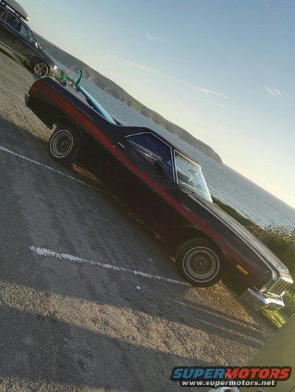 1974 Ford Ranchero, dark red coupe utility with red stripe, 3q-front view