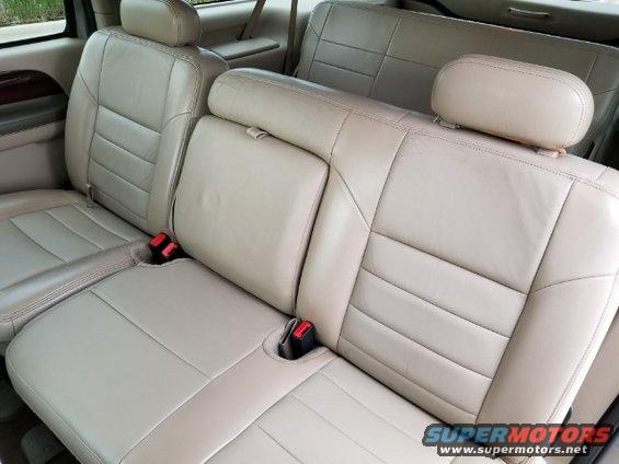 Tan leather seats and headrests in a 2003 Ford Excursion interior