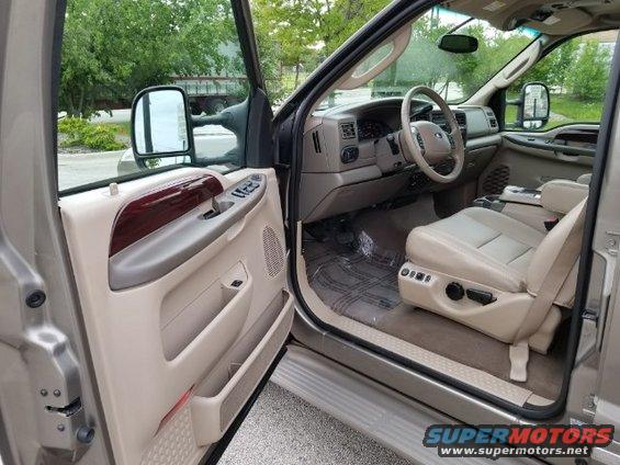 Interior of a 2003 Ford Excursion showing tan leather seats and dashboard