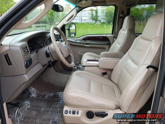 2003 Ford Excursion interior showing front seats, dashboard, and steering wheel
