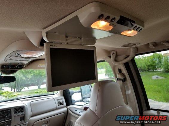 Interior of 2003 Ford Excursion with overhead screen and lights