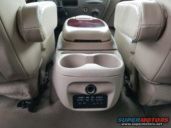 2003 Ford Excursion interior center console with dual cup holders and climate controls