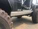 1995 Jeep YJ - 1995 Jeep YJ side view showing rocker protection and off-road tires.