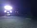 1995 Jeep YJ - Jeep YJ driving in snow at night with auxiliary lights on.