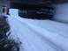 1995 Jeep YJ - A Jeep YJ navigates a snow-covered road, its spare tire visible.