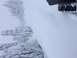 1995 Jeep YJ - A vehicle navigates through deep snow, with only a tire and part of the body visible.