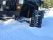 1995 Jeep YJ - A Jeep Wrangler is partially buried in snow, with its front tire and bumper visible.
