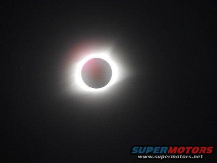 Solar eclipse with Supermotors.net logo