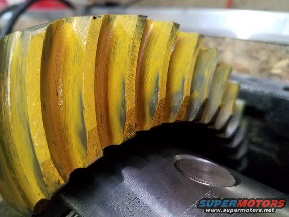 Yellow ring and pinion gear with wear marks