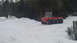 1986 Argo Response - A red tracked vehicle sits in a snowy landscape with trees in the background.