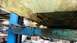 1999 Ford Fairlane - The vehicle's undercarriage is heavily corroded and appears to be structurally compromised.
