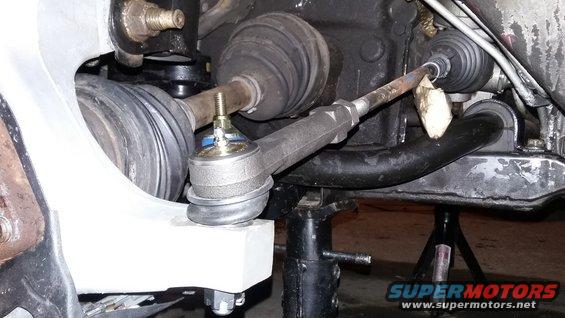 Ball joint and tie rod end on a vehicle suspension, supported by jack stands