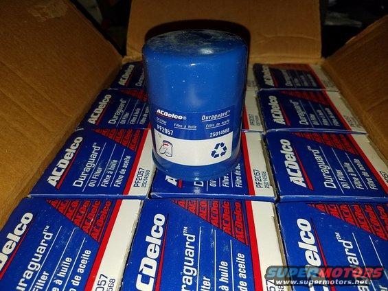 Box of ACDelco oil filters, one blue filter on top