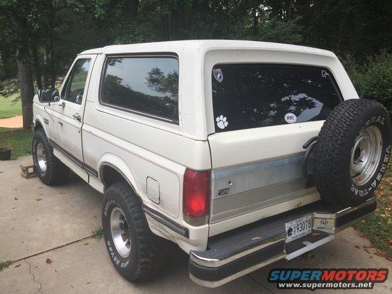 White 1988 Ford Bronco rear view with spare tire and license plate