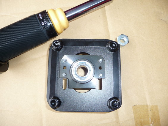 Strut mount with bearing and shock absorber component with text '0.2m/s +93 -49'