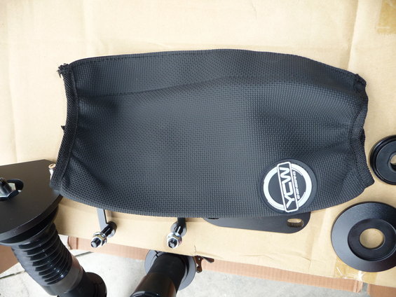 Black fabric cover with YCW logo and mounting hardware