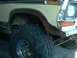 1979 Ford Bronco - This photo shows the front fender and wheel well of a lifted Ford Bronco, likely from the late 1970s.