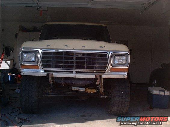 1979 Ford Bronco front view, beige, in garage, lifted suspension, aftermarket bumper
