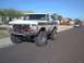 1979 Ford Bronco - This lifted Ford Bronco, likely a 1978 model, is parked on a residential street.