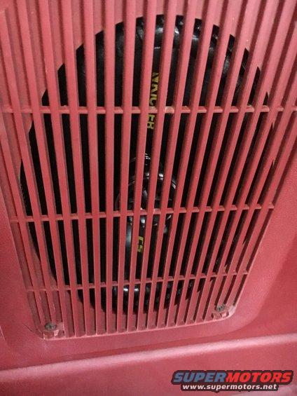 Red speaker grille with black speaker visible behind it. Text 'NAICHER' is visible on the speaker