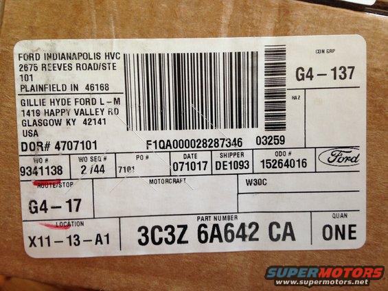 Shipping label on cardboard box with text and barcodes, including part number 3C3Z 6A642 CA