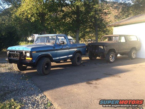 1978 Ford Bronco and a blue Ford pickup truck parked side-by-side