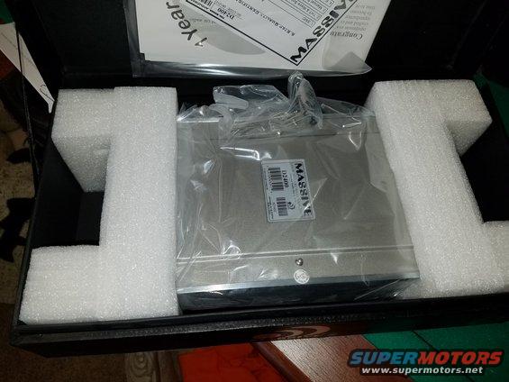 Massive stereo amplifier in box with foam padding and documentation