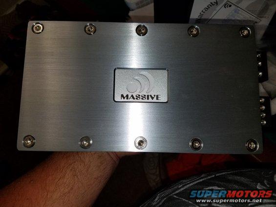 Car amplifier with 'MASSIVE' logo on brushed metal casing