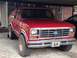 1986 Ford Bronco - Front view of a red Ford Bronco, likely from the early 1980s.