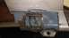 1996 Ford Bronco - This part of a vehicle shows significant rust and damage, indicating repair work is needed.