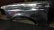 1996 Ford Bronco - A bare metal fender shows signs of bodywork and primer, indicating repairs or preparation for painting.