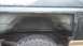 1996 Ford Bronco - The rear wheel well of a vehicle has been cut open, revealing rust and damage to the inner body panels.