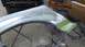 1996 Ford Bronco - Fender undergoing bodywork and repair in a workshop setting.