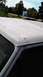 1996 Ford Bronco - Car roof with primer applied, detailing damage on the A-pillar and roof edge.