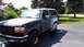 1996 Ford Bronco - This Ford Bronco is in the process of being prepped for paint, with primer visible on the body panels.