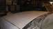 1996 Ford Bronco - The hood of a vehicle is covered in primer, ready for paint, with windshield wipers visible.