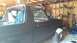 1996 Ford Bronco - This Ford Bronco is undergoing work in a garage, with its roof section removed and seats covered.