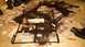 1996 Ford Bronco - Metal components are laid out on newspaper for painting in a garage setting.